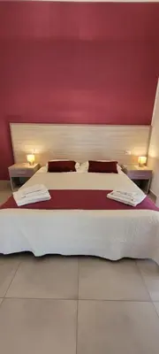 Letto o letti in una camera di RUMA GUESTHOUSE