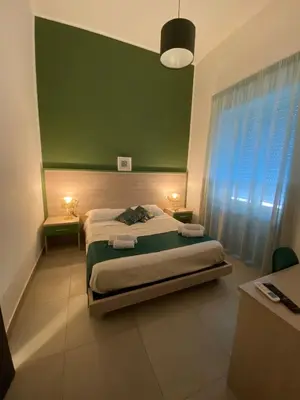 Letto o letti in una camera di RUMA GUESTHOUSE