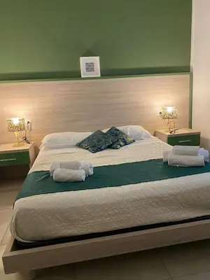 Letto o letti in una camera di RUMA GUESTHOUSE