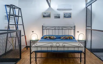 Letto o letti in una camera di GLIKA APPARTAMENTO NAPOLETANO