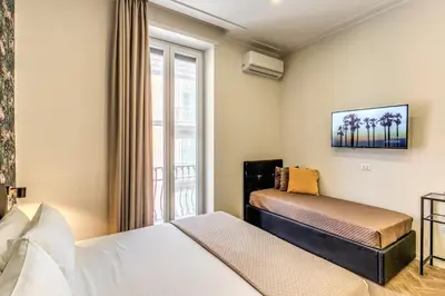 Letto o letti in una camera di Gravina8 - Rooms in Naples