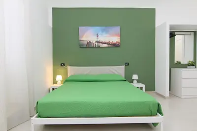 Letto o letti in una camera di Marea Appartamenti
