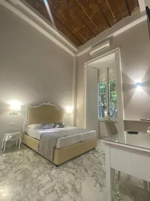 Letto o letti in una camera di MILUAR Luxury B&B - Vanvitelli