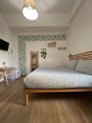 Letto o letti in una camera di Le camere del Nonno Luigi