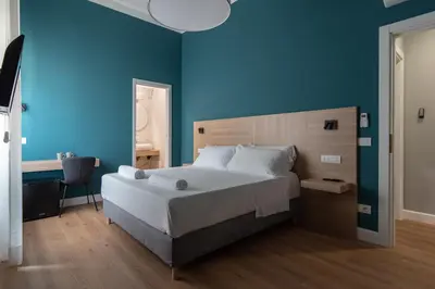 Letto o letti in una camera di Nolana 28 Rooms in Naples