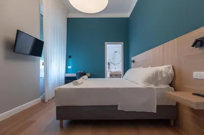 Letto o letti in una camera di Nolana 28 Rooms in Naples