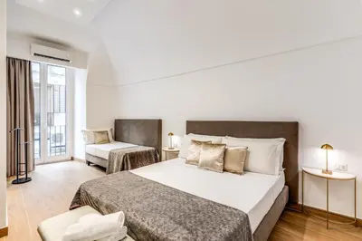 Letto o letti in una camera di Domus Partenopea