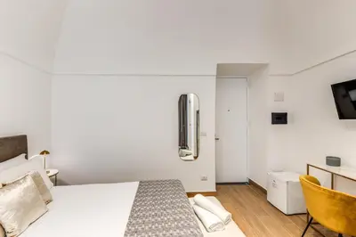 Letto o letti in una camera di Domus Partenopea