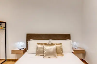 Letto o letti in una camera di Domus Partenopea