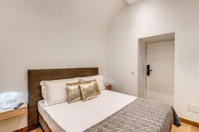 Letto o letti in una camera di Domus Partenopea