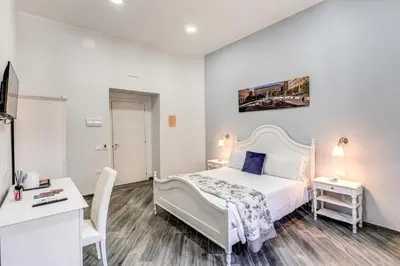 Letto o letti in una camera di Agorà Borsa