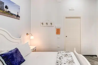 Letto o letti in una camera di Agorà Borsa