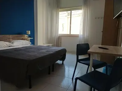 Letto o letti in una camera di NICE STAY