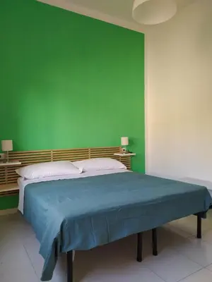 Letto o letti in una camera di NICE STAY