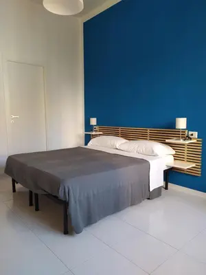 Letto o letti in una camera di NICE STAY