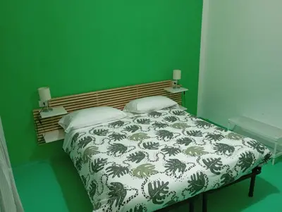Letto o letti in una camera di NICE STAY