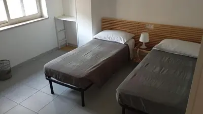 Letto o letti in una camera di NICE STAY