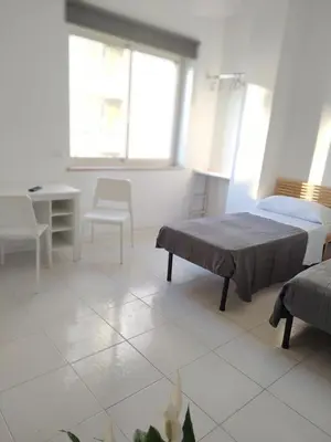 Letto o letti in una camera di NICE STAY