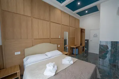 Letto o letti in una camera di P.C. Boutique H. Castel Nuovo, by ClaPa Group Dislocated Hospitality