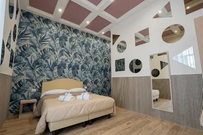 Letto o letti in una camera di GreRos H. Porto Napoli Centro, by ClaPa Group Dislocated Hospitality
