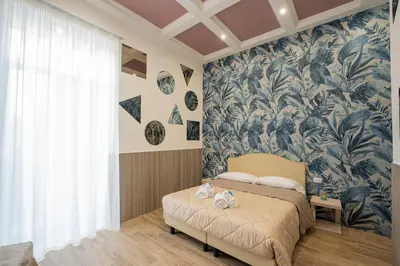 Letto o letti in una camera di GreRos H. Porto Napoli Centro, by ClaPa Group Dislocated Hospitality