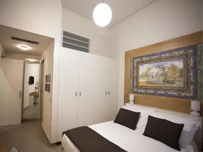 Letto o letti in una camera di Napolart