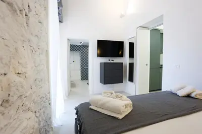 Letto o letti in una camera di GuestHost - Suite I Miracoli Central Apartment