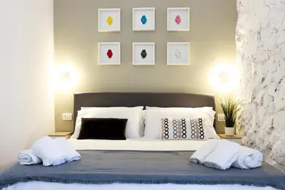 Letto o letti in una camera di GuestHost - Suite I Miracoli Central Apartment