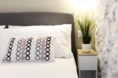 Letto o letti in una camera di GuestHost - Suite I Miracoli Central Apartment