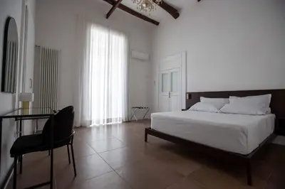 Letto o letti in una camera di Domus Delia Luxury Apartment