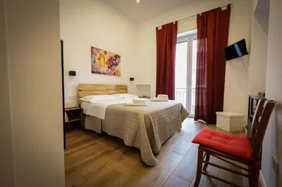 Letto o letti in una camera di Napoli Into Core - Bed & Breakfast
