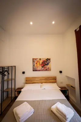 Letto o letti in una camera di Napoli Into Core - Bed & Breakfast