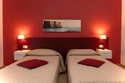 Letto o letti in una camera di Casa Amato_2_Regina Giovanna