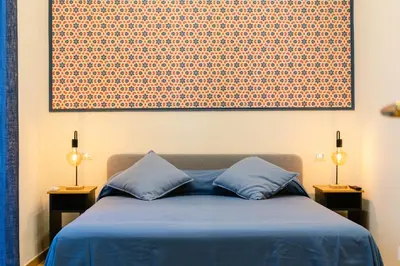 Letto o letti in una camera di Calaba Chiaia