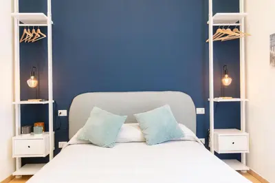 Letto o letti in una camera di Calaba Chiaia