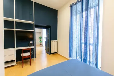 Letto o letti in una camera di Calaba Chiaia