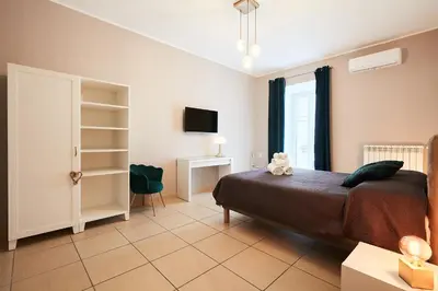 TV o dispositivi per l'intrattenimento presso Vicky's Luxury Guesthouse by NapoliApartments