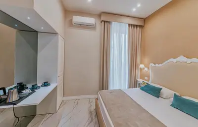 Letto o letti in una camera di Gentile Suite & Spa Vomero