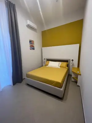 Letto o letti in una camera di Dimora Chiaia