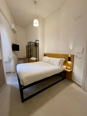 Letto o letti in una camera di NaBaB-Napoli Bed And Breakfast