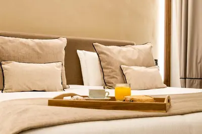 Letto o letti in una camera di MAMALU - Studios and Suites