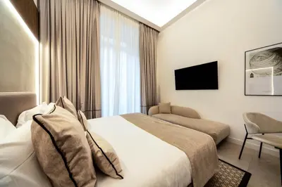 Letto o letti in una camera di MAMALU - Studios and Suites