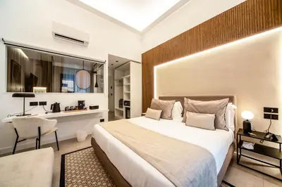 Letto o letti in una camera di MAMALU - Studios and Suites