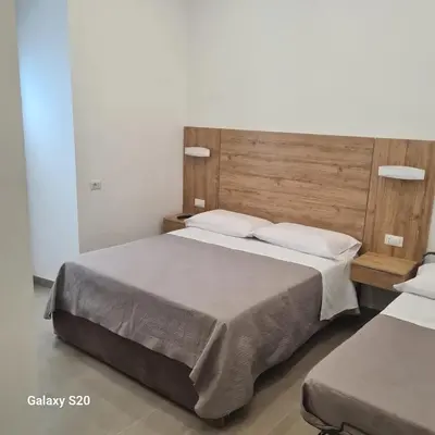 Letto o letti in una camera di Residenza Nascari al Plebiscito