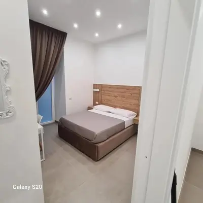 Letto o letti in una camera di Residenza Nascari al Plebiscito