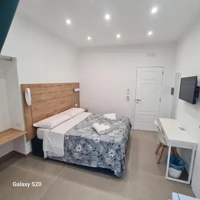 Letto o letti in una camera di Residenza Nascari al Plebiscito