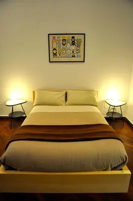 Letto o letti in una camera di Casa del Plebiscito
