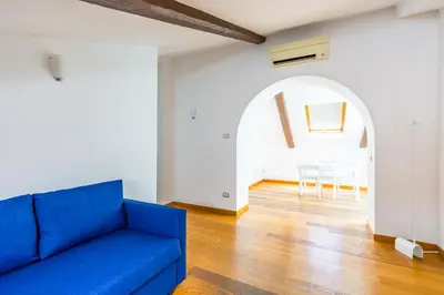 Area soggiorno di Attico al Duomo by Napoliapartments