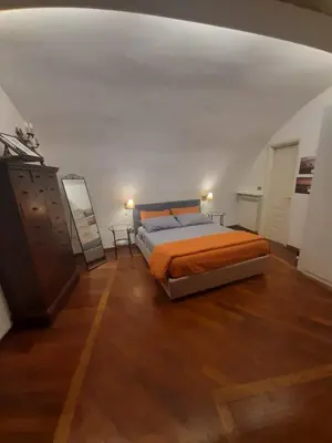 Letto o letti in una camera di la casa di Francesca