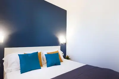 Letto o letti in una camera di Terrazza Manuela Apartments Quartieri Spagnoli